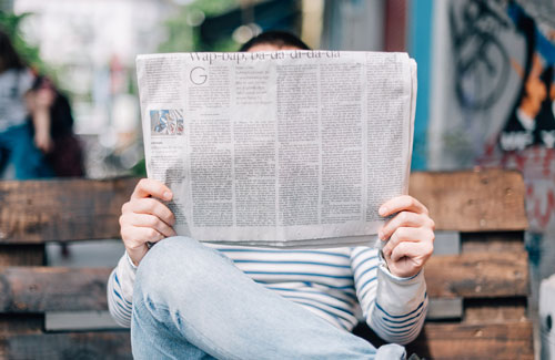 man holding newspaper